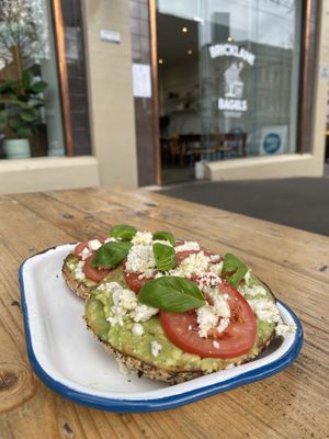Avo, tomato, basil and vegan feta on a mixed seed bagel  at Bricklane Bagels in South Melbourne