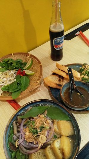 Silky eggplant on the right, tofu pho in the middle and extras on the left. at Banh Mi in Antwerpen