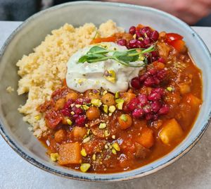 The dish "marokanen", vegetables & pomegranate served with cous cous, pistachios and yoghurt. at Skrymslet Under Trappan in Norrkoping