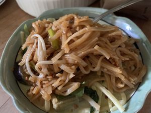 Carry out! Pad Thai and green curry. at Happy Thai in Bloomington