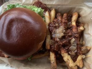 burger with chili cheese fries at Chicana Vegana in Fullerton