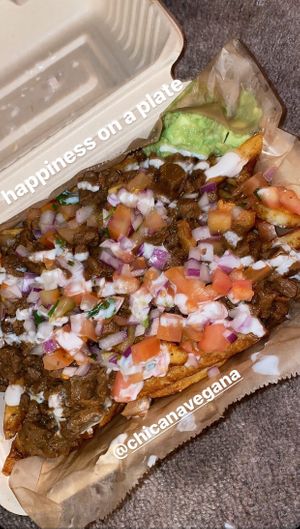 signature fries with asada and carnitas at Chicana Vegana in Fullerton