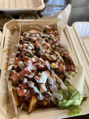 Chili cheese fries with extra $3 toppings “supreme” style  at Chicana Vegana in Fullerton