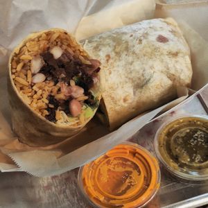 " MEXGOGI BAE-RITO
" with chipotle sauce at Chicana Vegana in Fullerton