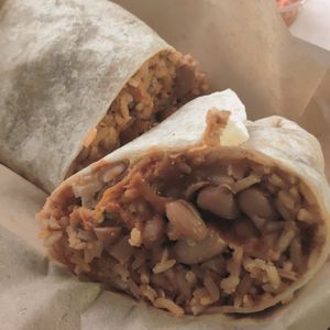 Red chilaquiles burrito. Tortilla in tortilla yum at Chicana Vegana in Fullerton