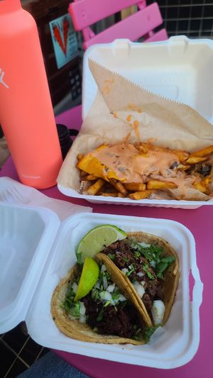 Vegan animal style fries, vegan al pastor taco and vegan carne asada taco! at Chicana Vegana in Fullerton