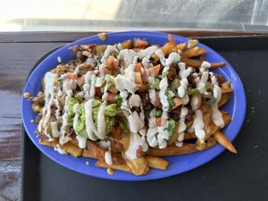 Signature fries with al pastor + carnitas  at Chicana Vegana in Fullerton