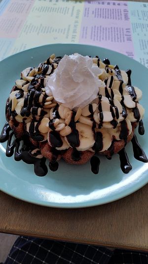 Vegan waffle with Chocolate, banana, almonds and wipped cream at Heart-Garden Waffles & Coffee in Amsterdam