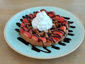 Chocolate sauce, maple syrup, strawberries, and vegan cream at Heart-Garden Waffles & Coffee in Amsterdam
