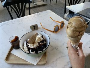 Cup with banana and stracciatella ice cream, chocolate sauce and whipped cream + cone with coffee and hazelnut ice cream    at IceLab NiceCream Creations in Antwerpen