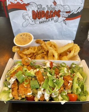 Vegan schnitzel salad and onion rings  at Burger Urge in Bundaberg