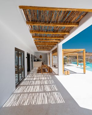 Dining by the pool at Koukoumi Hotel in Mykonos