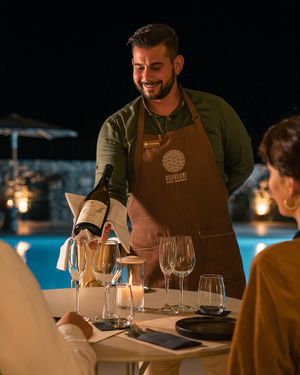 Dining Area by the pool  at Koukoumi Hotel in Mykonos