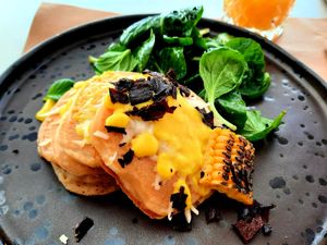 Savory pancakes with cheese and hollandaise sauce at Koukoumi Hotel in Mykonos