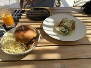 Burger and smoked salad   at Koukoumi Hotel in Mykonos