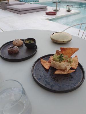 Olive dip and freshly baked bread and guacamole with dippers at Koukoumi Hotel in Mykonos