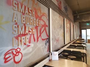 Seating area at Huxtaburger in Redfern