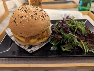 Mushroom burger with "cheddar" sauce and caramelized onions. Yum! at BEIJU HEALTHY FUN FOOD in Cascais