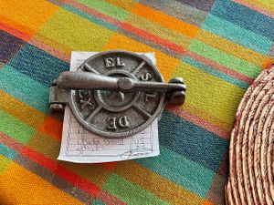 La cuenta (the check) in a mini tortilla press at Frida in Ajijic