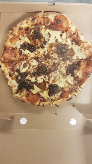 Caramelised onion and coconut bakon sourdough pizza. at Craft Vegan Pizza in Ryde