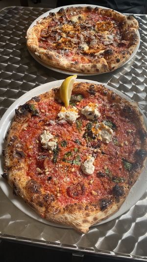 pizza puglia in the front and dr drooly in the back  at Dr Drooly in Munich