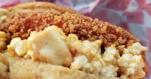 Made fresh daily, our warm sweet potato biscuit is stuffed with a spicy chick'n patty, tofu scramble, and vegan cheddar cheese. Served with Original Plant Fries and jelly. at Plant Bae in Montgomery