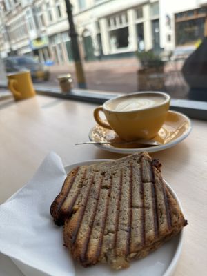 Flat white (oat milk) and banana breadd  at Tigershark Coffee in The Hague