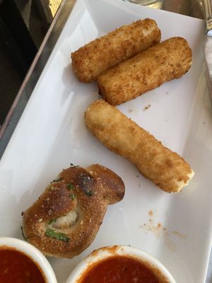 Mozzarella sticks, hearts of palm sticks and garlic knot - also their marinara sauce is delicious!!!  at Pizzanada in Bloomfield