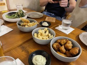 A spread of munchies - nuggets, broccolini, Enoki & calamari   at Love Handle in Central Singapore