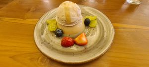 Oat milk pudding with vanilla ice cream and smoked fruit at Love Handle in Central Singapore