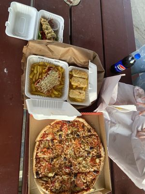 Top to bottom- mushroom pack, eggplant parmi pack (subbed for tofu as they were out of eggplant), battered tofu, garden pizza with vegan cheese.  at The Shack in Aldinga Beach