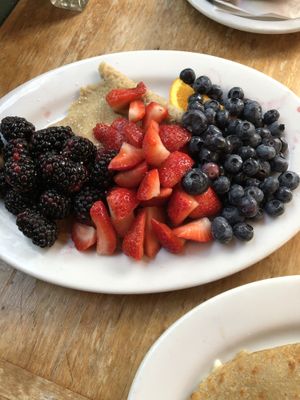 Fruit crepe. Topped with tons of fruit 🍓🫐  at The Crêpe Place in Santa Cruz