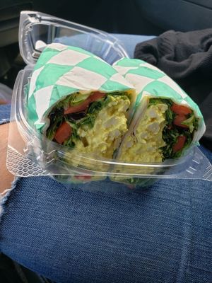 Egg salad sandwich on a tortilla roll up with sprouts, lettuce and tomato at Dunedin Vegan Deli in Clearwater