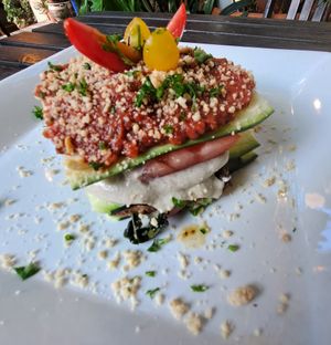 Loving Lasagna: zucchini noodles, hemp seed pesto, cashew alfredo, and Marinated veggies. Topped with marinara and cashew parm at Peace Pies in San Diego