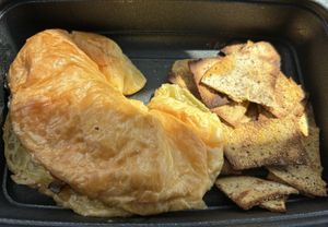 Portobello Croissant Sandwich with fresh, gently seasoned toasted Cauliflower chips.  at Roots PBC in Atlanta
