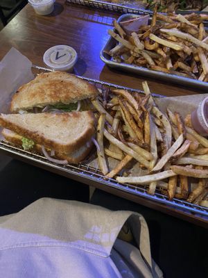chickpea salad sandwich with onion instead of tomato with a side of fries and vegan ranch  at Trinity Brewing Company in Colorado Springs
