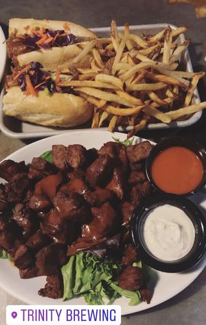 Seitan wings with buffalo and ranch sauce, along with the bbq pulled jackfruit sandwich & fries.  at Trinity Brewing Company in Colorado Springs