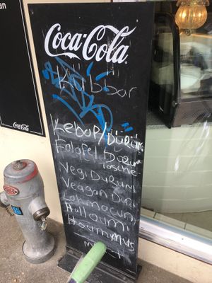 The blackboard in front of their restaurant with their Veggie and Vegan options (Vegan spellt wrong) at küBBan in Biel