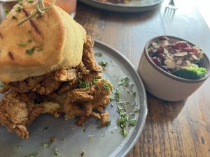 Agave Butter Chicken Biscuit with Broccoli Quinoa Salad  at TLC Vegan Kitchen in Richardson