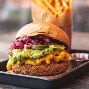 The SOS (Song of the South) A Country Fried Impossible Patty w/ House Made Mac N' Cheese, Avocado Mash, Bar B Q Sauce, Pickles, & Citrus Pickled Onions! at TLC Vegan Kitchen in Richardson