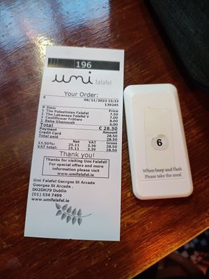 Receipt and a device to tell you when your order is ready at Umi Falafel - George's St Arcade in Dublin