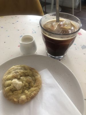  Iced americano with oat milk and cookiiieee  at Greenfinch in Berlin