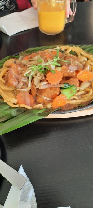 Fried eggplant on sizzle noodle platter at Veggo Sizzle in Five Dock