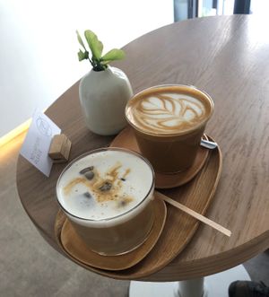 Iced cappucino and flat white, both with pea milk at 4minutes Cafe in Budapest