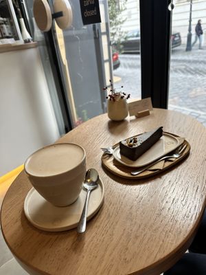 Chai latte & chocolate orange cake  at 4minutes Cafe in Budapest