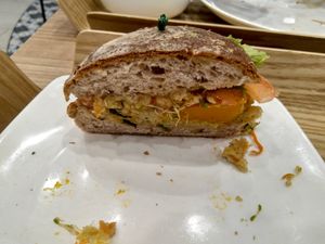 Half of the quinoa tofu pumpkin burger with walnut nap bread at Cedele - Novena Square in Central Singapore