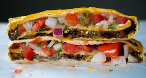 Crunch Wrap
Taco BEef, Queso, Tostada, Garlic Aioli, PIco and wrapped in Flour Tortilla at Mashup Market -  BeHive Deli in Denton