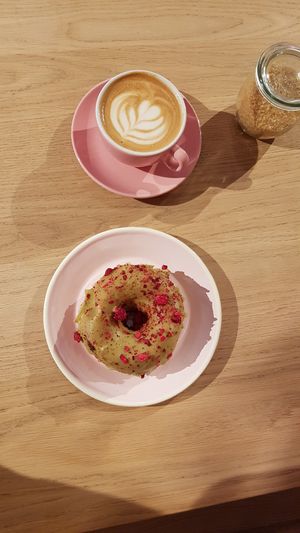 Flat white & matcha strawberry donut at Brammibal's Donuts - Friedrichshain in Berlin