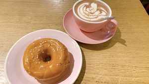 salted caramel hazelnut donut + hot chocolate  at Brammibal's Donuts - Friedrichshain in Berlin