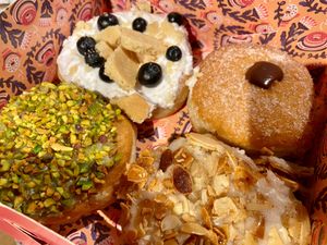 Blueberry cheesecake, chocolate, pistachio, and Bienenstich at Brammibal's Donuts - Friedrichshain in Berlin